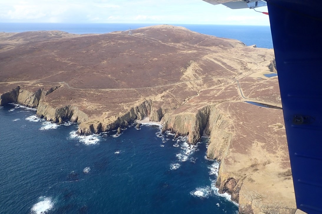 View of cliffs of fair Isle from aeroplane
